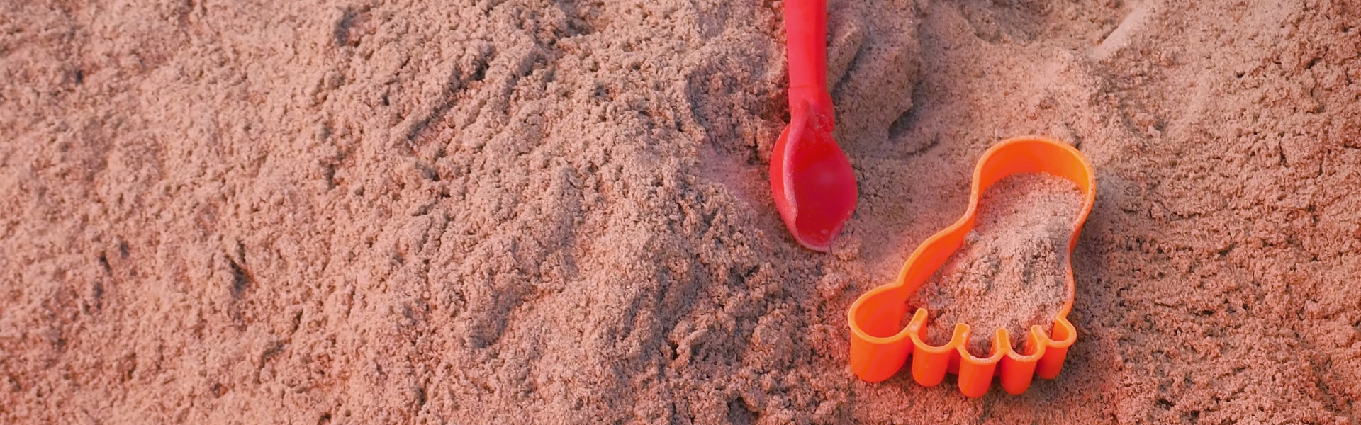 Childrens toys in a sandpit.